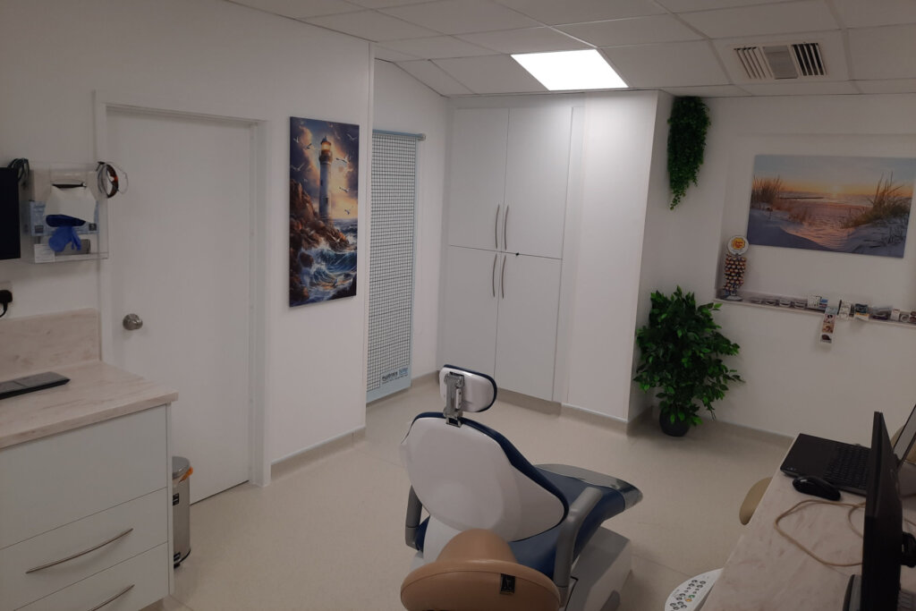 Darvell Bruderhof surgery 1 behind chair